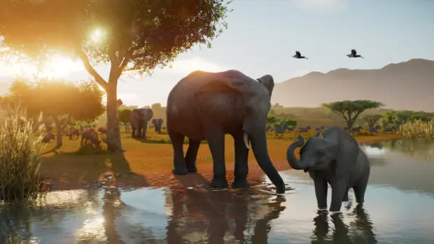 Słonie przy wodopoju o zachodzie słońca w grze Planet Zoo 2