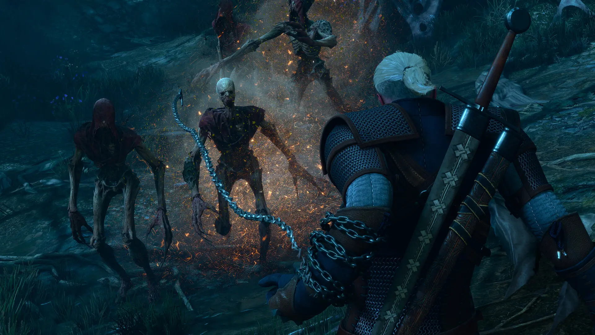 Geralt walczy srebrnym łańcuchem z grupą potworów w lesie