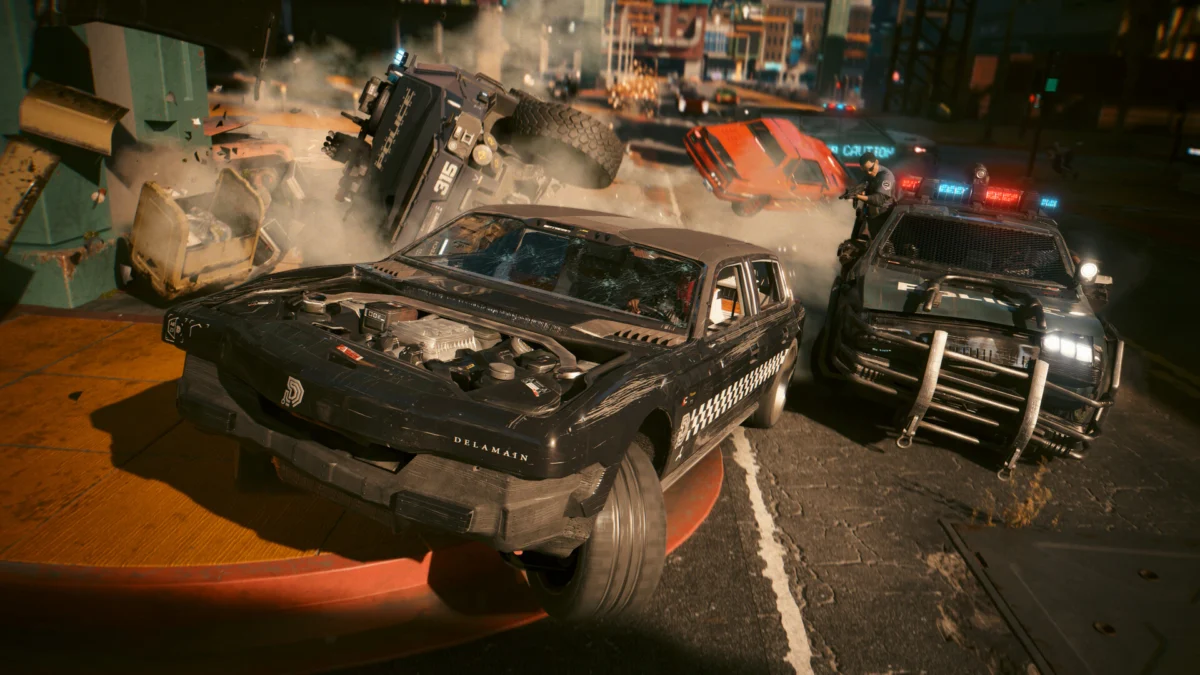 Cyberpunk 2077: pościg z radiowozami NCPD Rozbite samochody i radiowozy NCPD podczas pościgu na ulicy Night City w Cyberpunku 2077