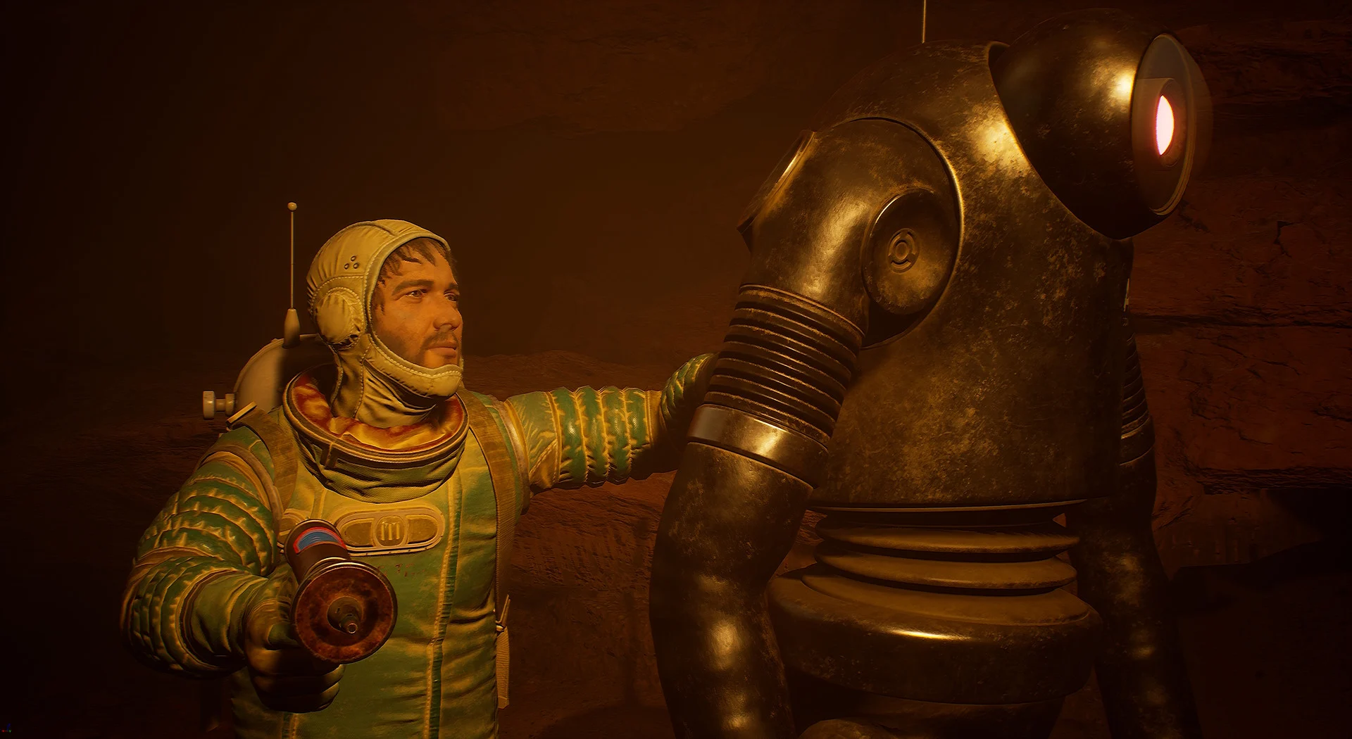 Astronauta w skafandrze obok dużego robota w jaskini w The Invincible