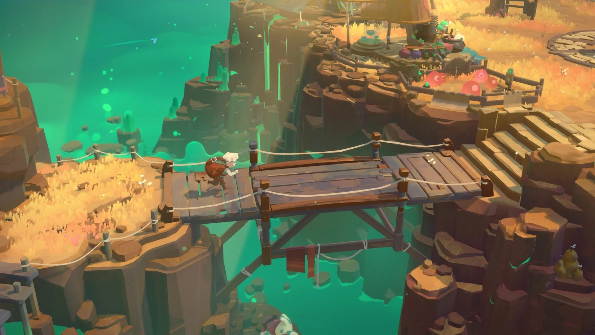 Will przechodzi po drewnianym moście między klifami w Moonlighter 2