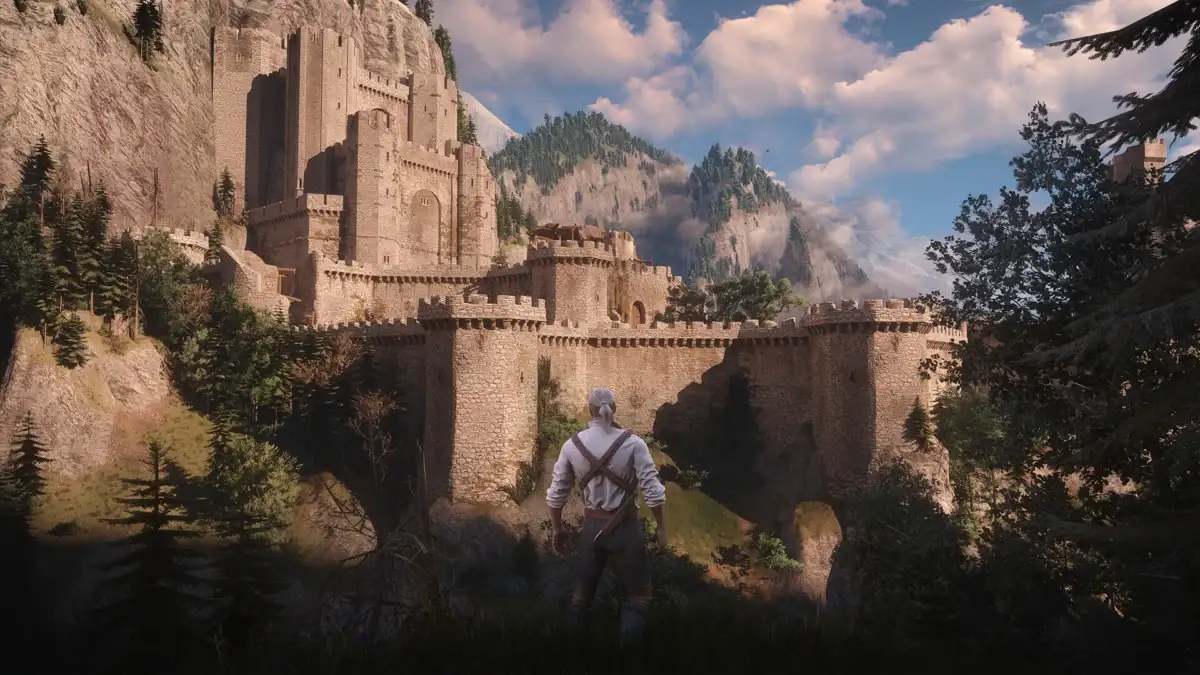 Geralt przed zamkiem w Toussaint w Wiedźminie 3: Dziki Gon Remaster